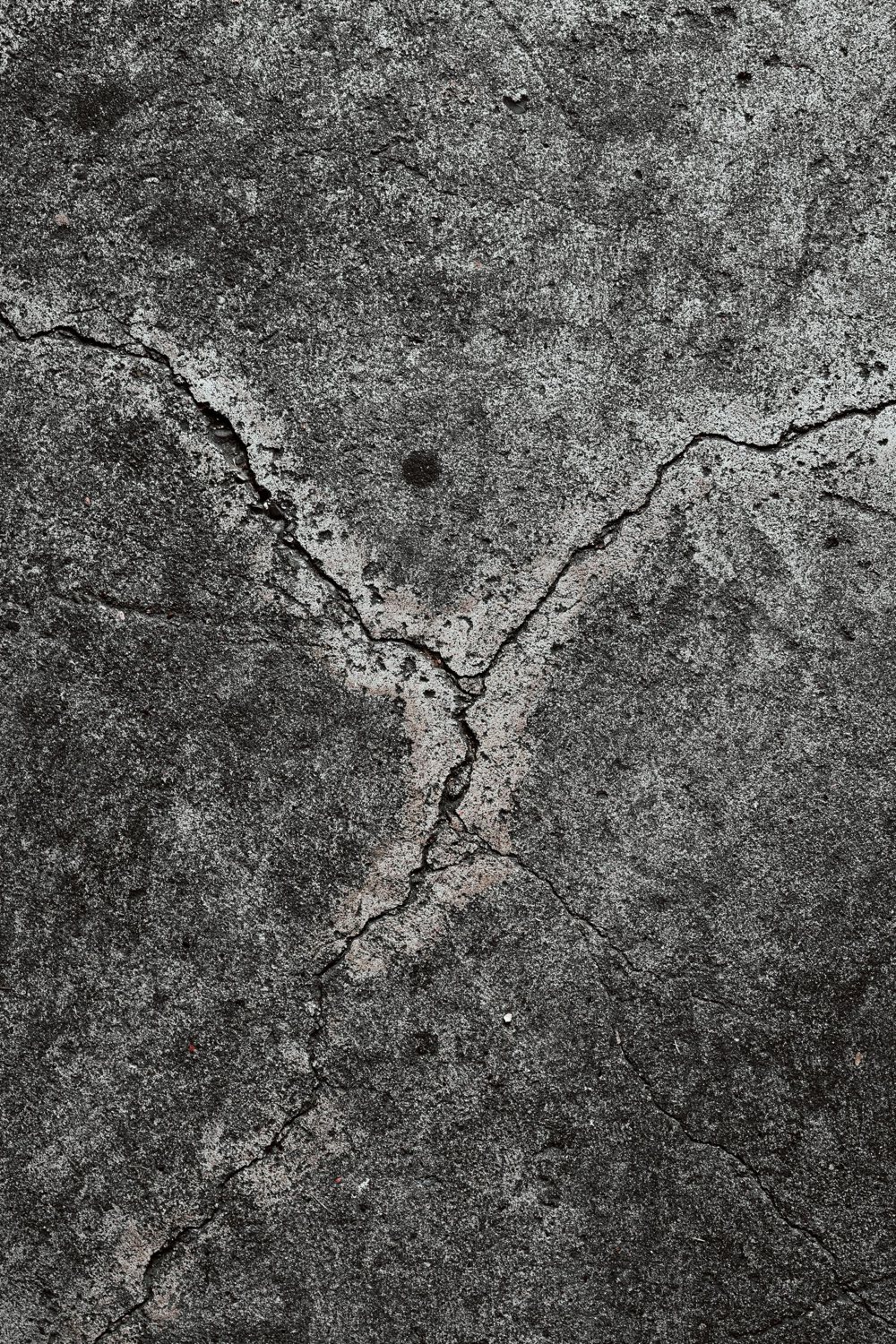 Intersecting cracks crossing a weathered concrete slab